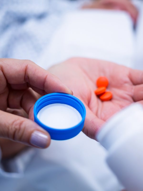 Nurse giving medication to patient