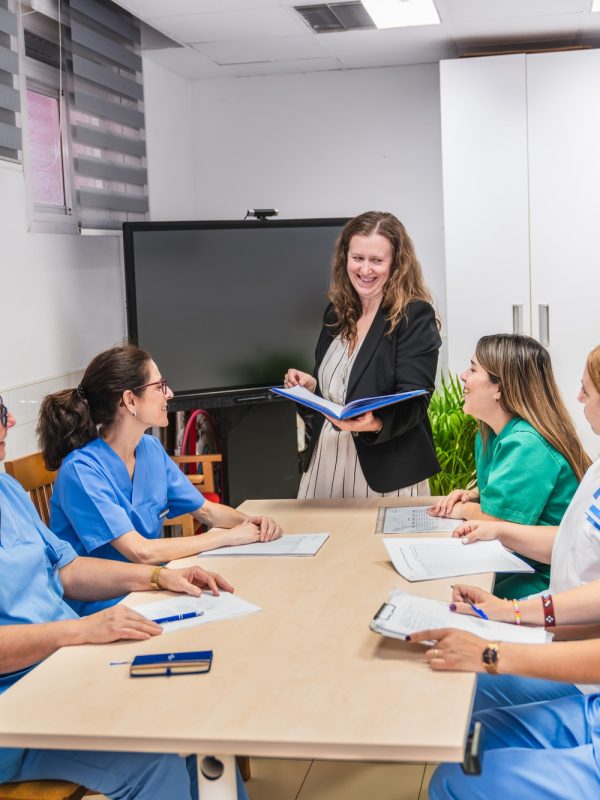 Nurses engaging in team meeting at nursing home