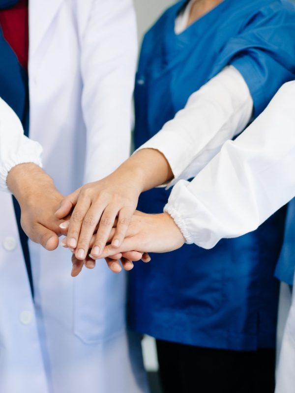 Team Doctors nurses union coordinate hands Teamwork Concept in hospital for success